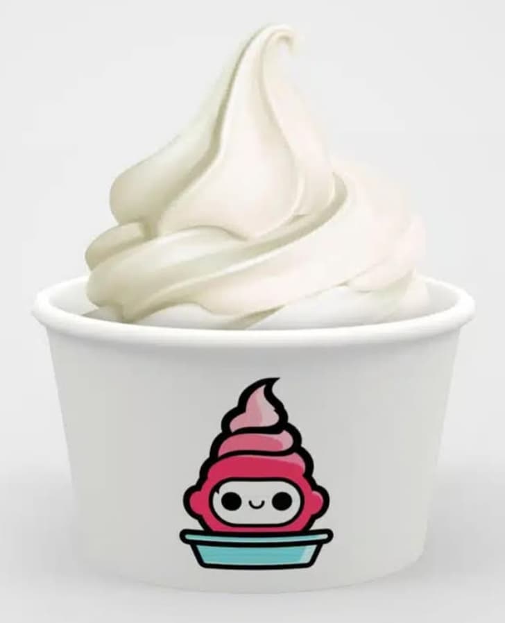 Side of the FroYoRobo machine with the ordering screen and a soft-serve cup